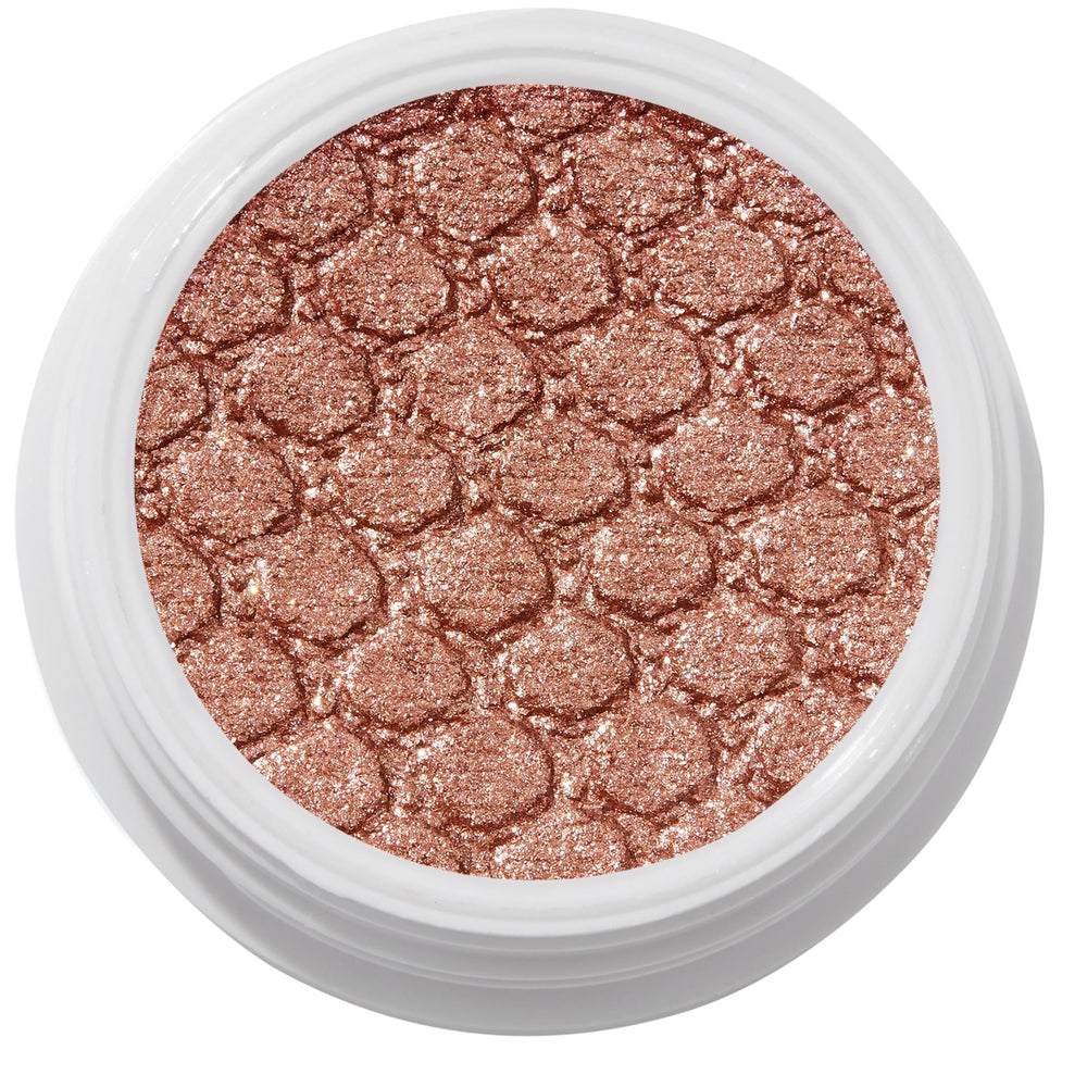 ColourPop Sequin Super Shock Shadow shimmers in metallic copper rose-gold as it catches light, pressed with a scale-embossed texture in a white round pot, shown in a clean studio overhead close-up.