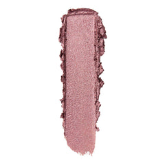Metallic rose-mauve eyeshadow swatch smeared in a single vertical swipe with textured edges on a white background, showcasing the Next Spot ColourPop Shadow Stix - creamy stick shadow with fine shimmer.