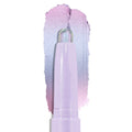 Colourpop Cotton Candy Shadow Stix crayon tip gliding upward, leaving a shimmering pastel lavender-to-pink duochrome eyeshadow swatch on a clean white background, showing smooth, blendable cream texture.