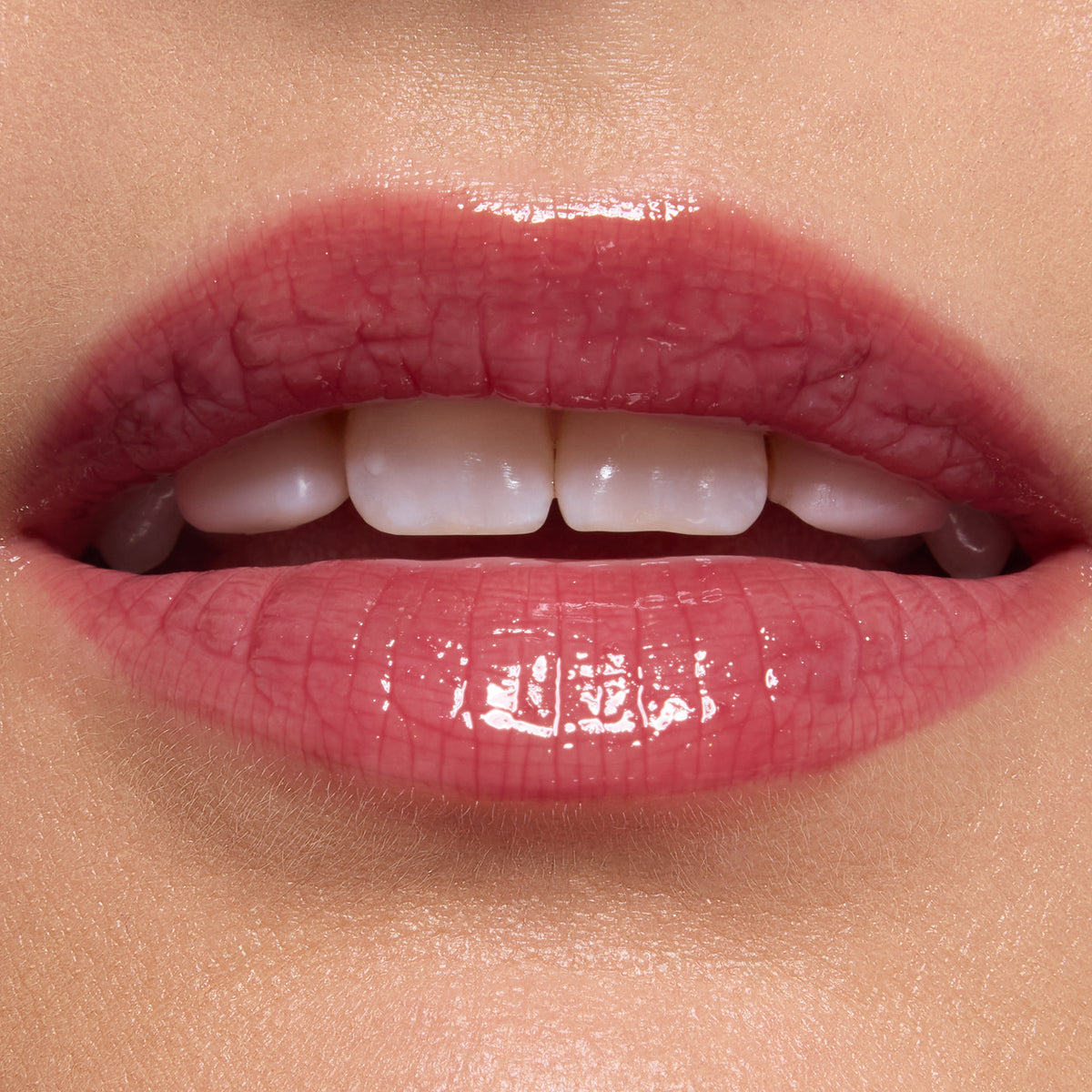 Glossy pink lips wearing ColourPop Ultra Glossy Lip, shade Short Lord, delivering a sheer rosy tint with mirror-like shine; close-up beauty swatch on smooth skin highlights the plush texture and reflective finish.