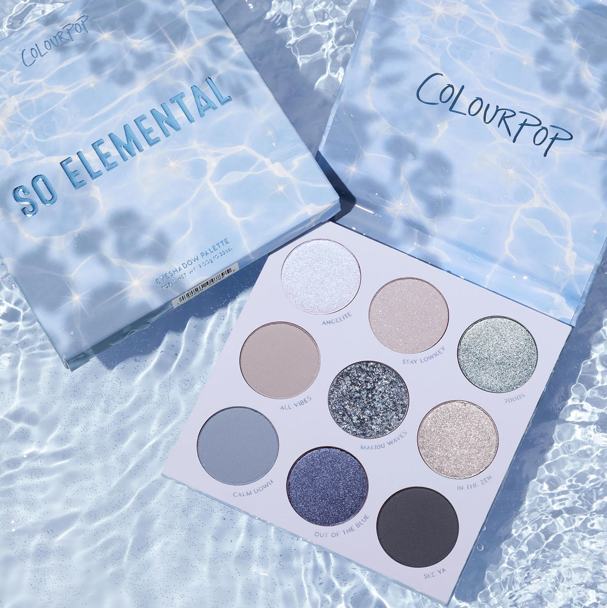So Elemental ColourPop Shadow Palette displayed open on rippled pool water, revealing nine cool‑toned matte, shimmer, and glitter shades - icy blue, taupe, and silver - beside the water‑print lid and branded box.