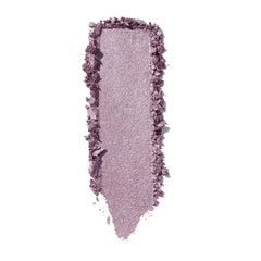 The Griffith Super Shock Shadow by ColourPop swatched in a single vertical swipe, a cool-toned lilac-mauve with silver sparkle and metallic sheen, creamy texture with crumbled edges, on a bright white background.