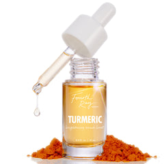 Fourth Ray Beauty Turmeric Serum bottle with dropper releasing a golden droplet, set amid mounds of turmeric powder on a white backdrop; brightening face serum, 0.4 fl oz (12 ml), ColourPop Face Serum for glowing skin.