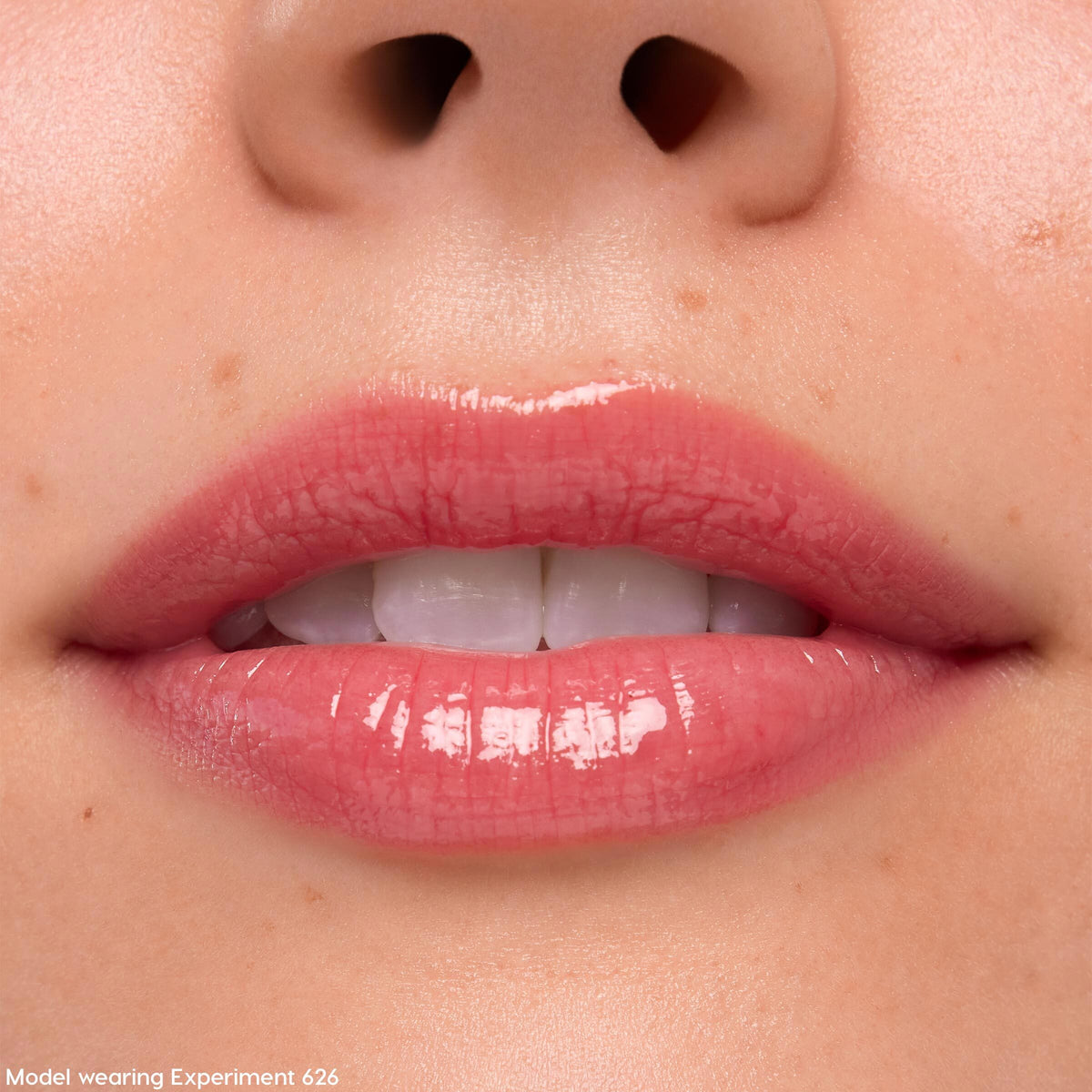 Lips coated in Keepin’ It Sweet Ultra Glossy Lip (ColourPop Ultra Glossy Lip) gleam with a sheer pink, glassy finish in a tight close-up, highlighting smooth texture and shine around the mouth.