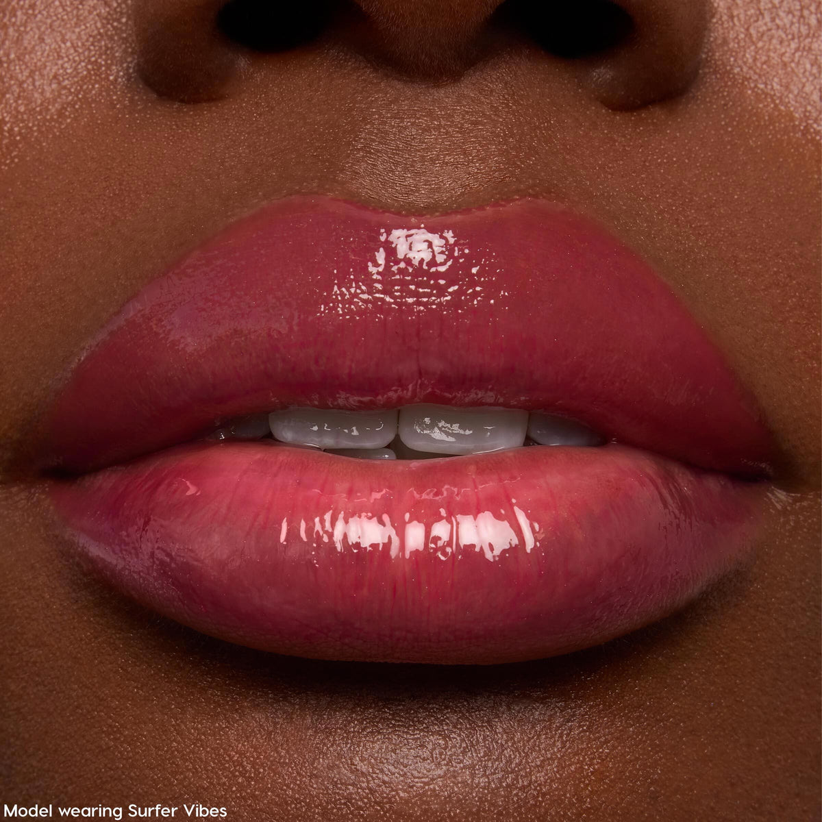 Glossy lips wearing ColourPop Ultra Glossy Lip, Keepin’ It Sweet - sheer rose-pink shine applied evenly with a glassy, reflective finish; extreme close-up showcases hydrated texture and subtle tint on natural lips.