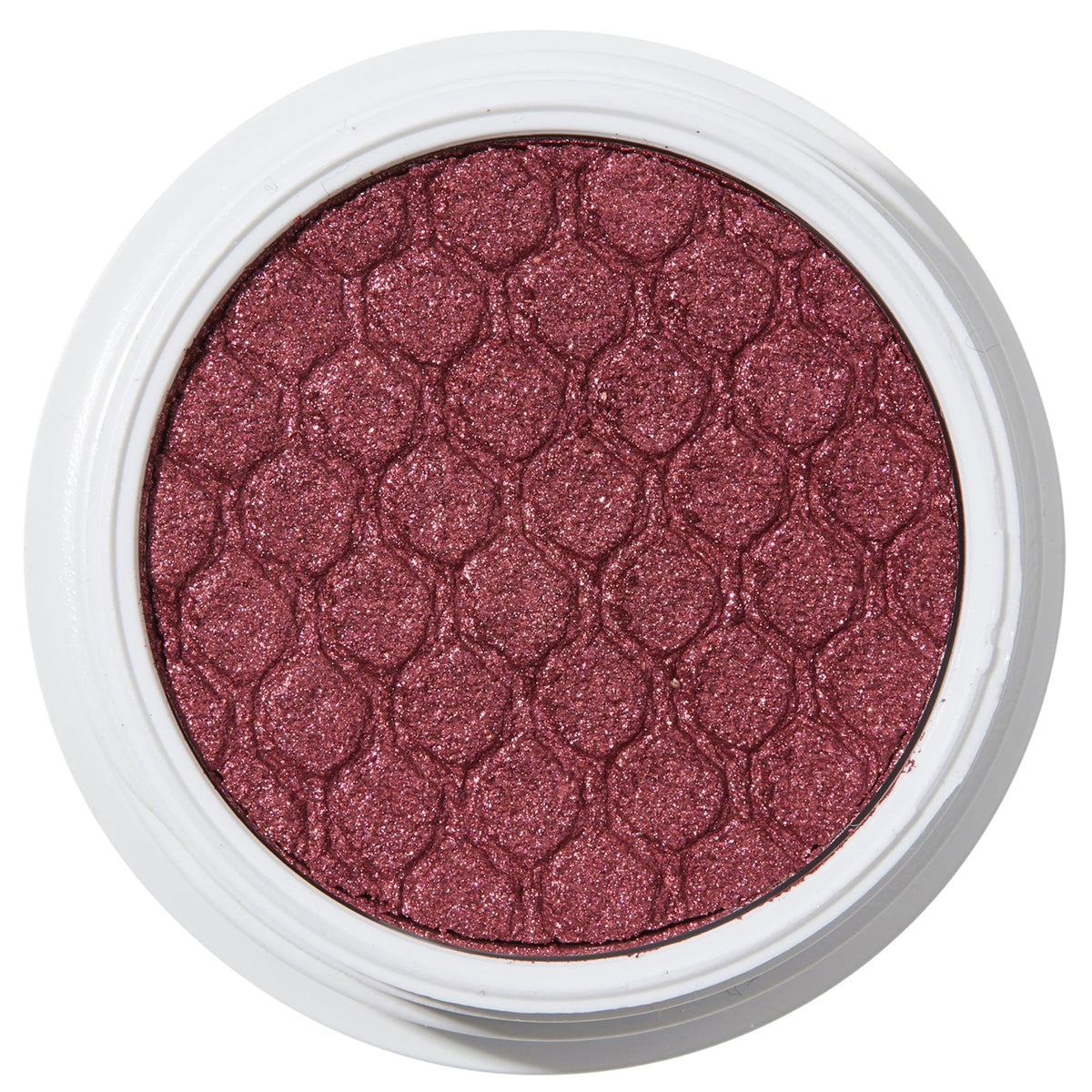 ColourPop Drift Super Shock Shadow displays a metallic cranberry-burgundy shimmer, pressed with a quilted scale pattern, sitting in a round white pot on a plain white studio background.