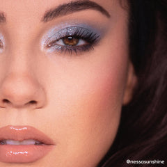 So Elemental ColourPop Shadow Palette creating a cool-toned, shimmery blue smoky eye with inner-corner highlight and lengthened lashes, shown in a close-up of a person’s eye and nude glossy lips under soft studio lighting.