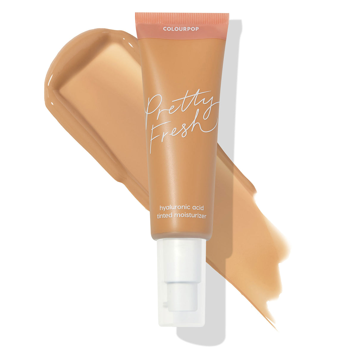 Pump-top tube of ColourPop Pretty Fresh Tinted Moisturizer, shade Medium 12 W (warm medium, with hyaluronic acid), lying across a creamy tan swatch on a white background, highlighting a hydrated, sheer-coverage finish.