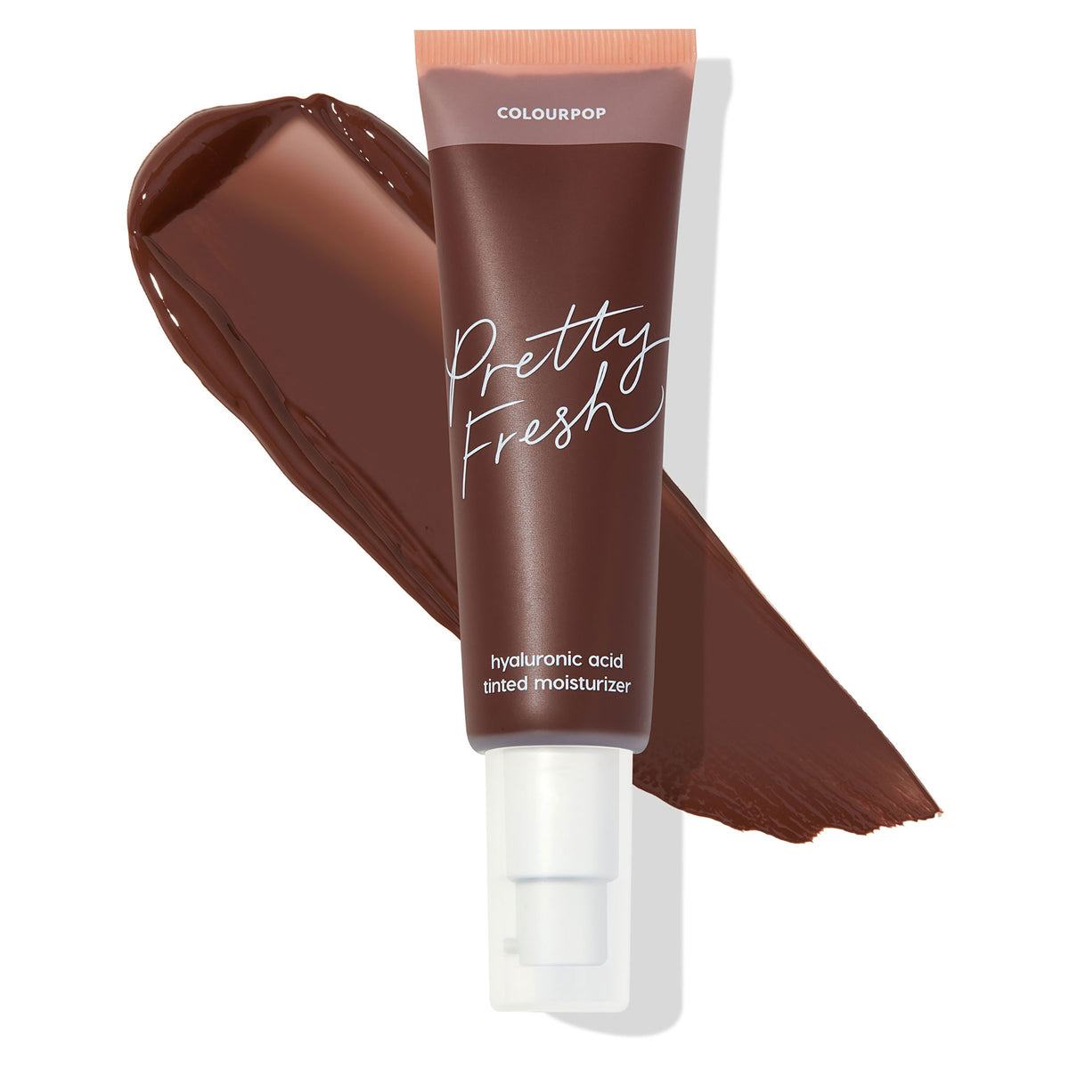 ColourPop Pretty Fresh Tinted Moisturizer tube in Deep Dark 24 N stands over a smooth deep-brown swatch, showing shade payoff; pump packaging with peach cap and white script highlights the hyaluronic acid formula on a clean white backdrop.