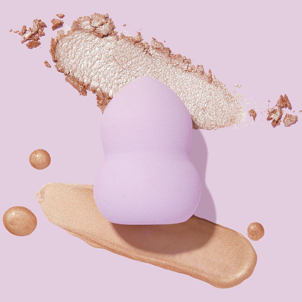 Hourglass Blending Sponge in between product swatches 