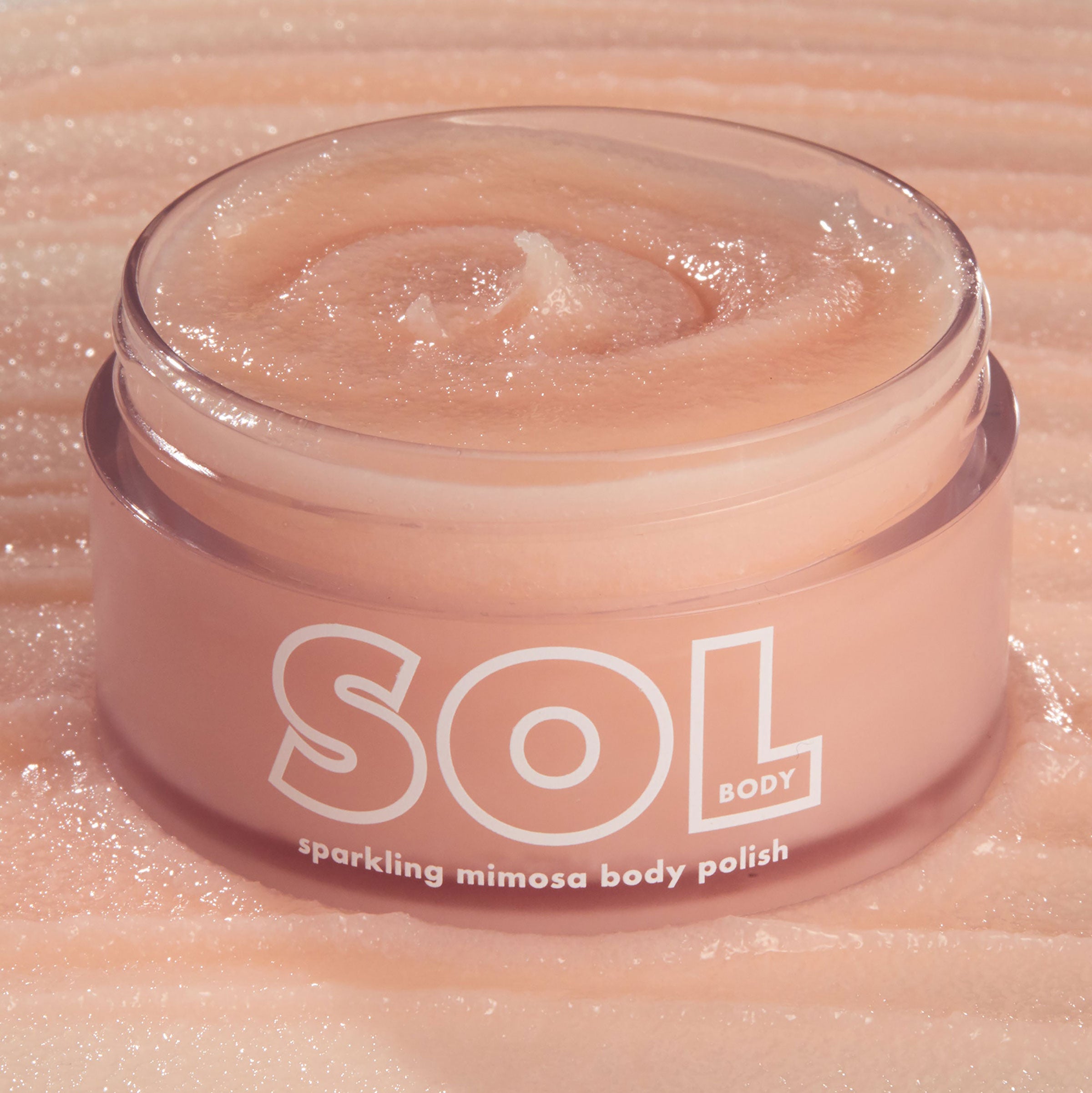 SOL Body Sparkling Mimosa Body Polish – A luscious body polish gently buffs and exfoliates to reveal skin so silky soft and smooth.  