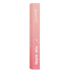 Love Life Lippie Stix stands upright, displaying a pink gradient box with white ColourPop branding, sparkles, and bold “lippie stix” text; shade Love Life, net wt 1.0 g (0.035 oz); ColourPop Lippie Stix on a clean white background.