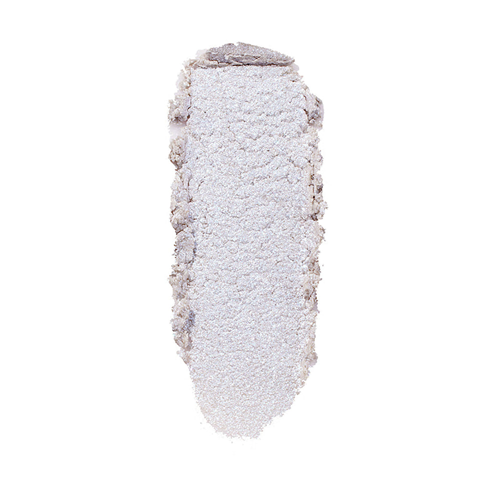 ColourPop Honeymoon Super Shock Highlighter swatch catching light as a long, oval smear of icy silver‑lavender shimmer with soft, crumbly edges, shown isolated on a clean white background.