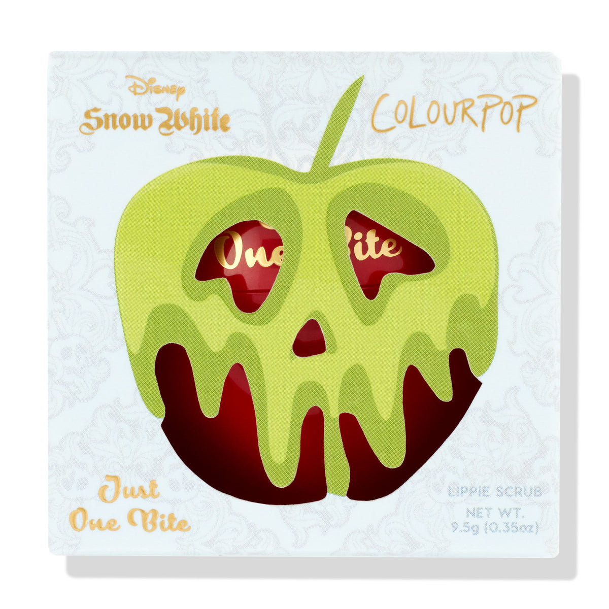 ColourPop Lip Scrub Just One Bite, a Disney Snow White collab, packaged in a white box featuring a lime-green dripping poison apple die-cut that reveals the red jar inside, gold script accents, and net wt 9.5 g (0.35 oz), shown on a white background.